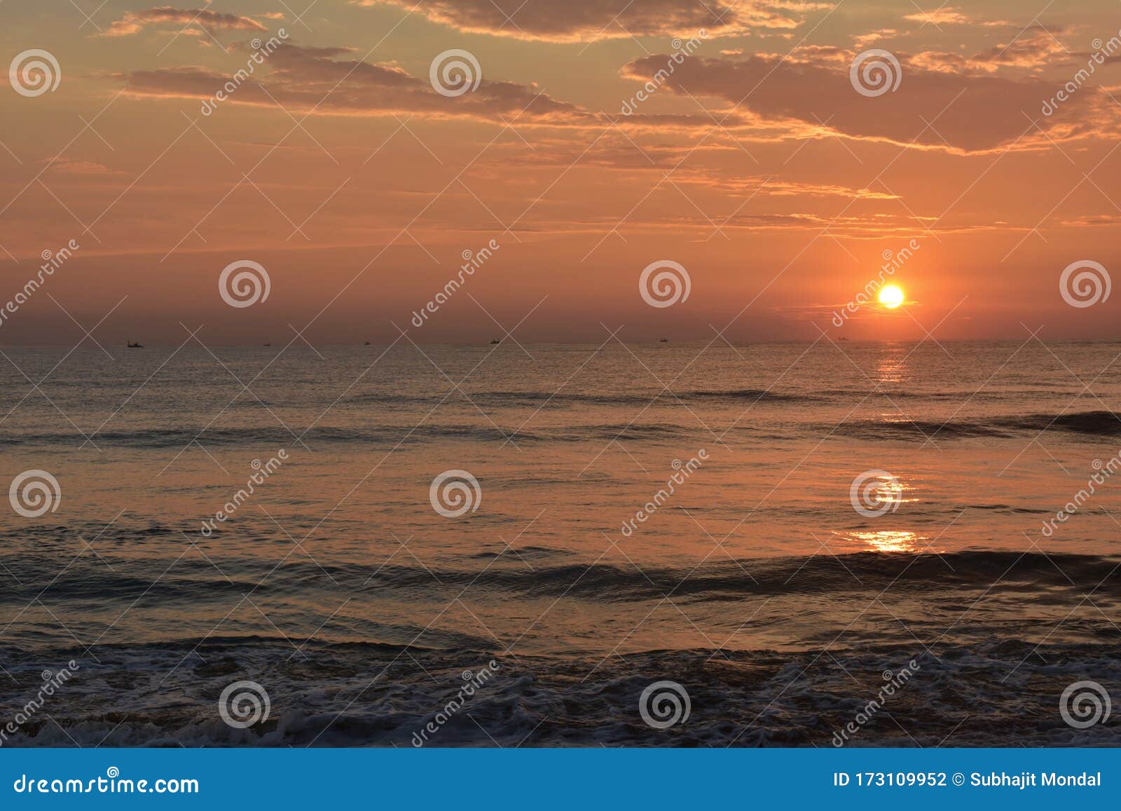 A Beautiful Evening in a Beach with a Sunset into a Ocean Stock ...