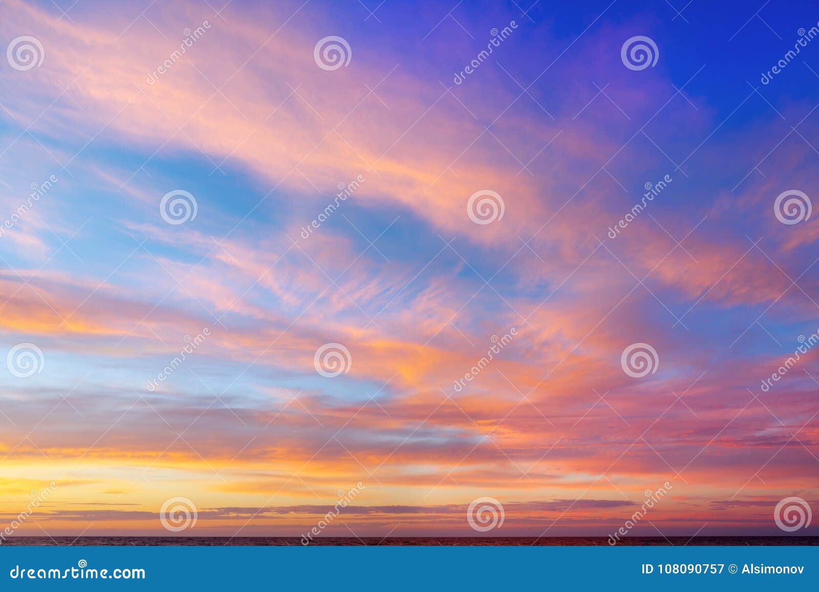 beautiful evening sky with pink clouds. sunset over the sea