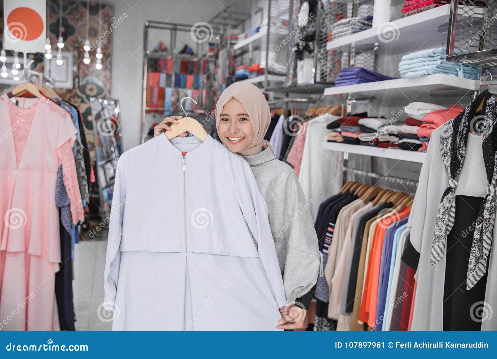 Asian Muslim Woman Buy Clothes at Fashion Boutique Stock Image