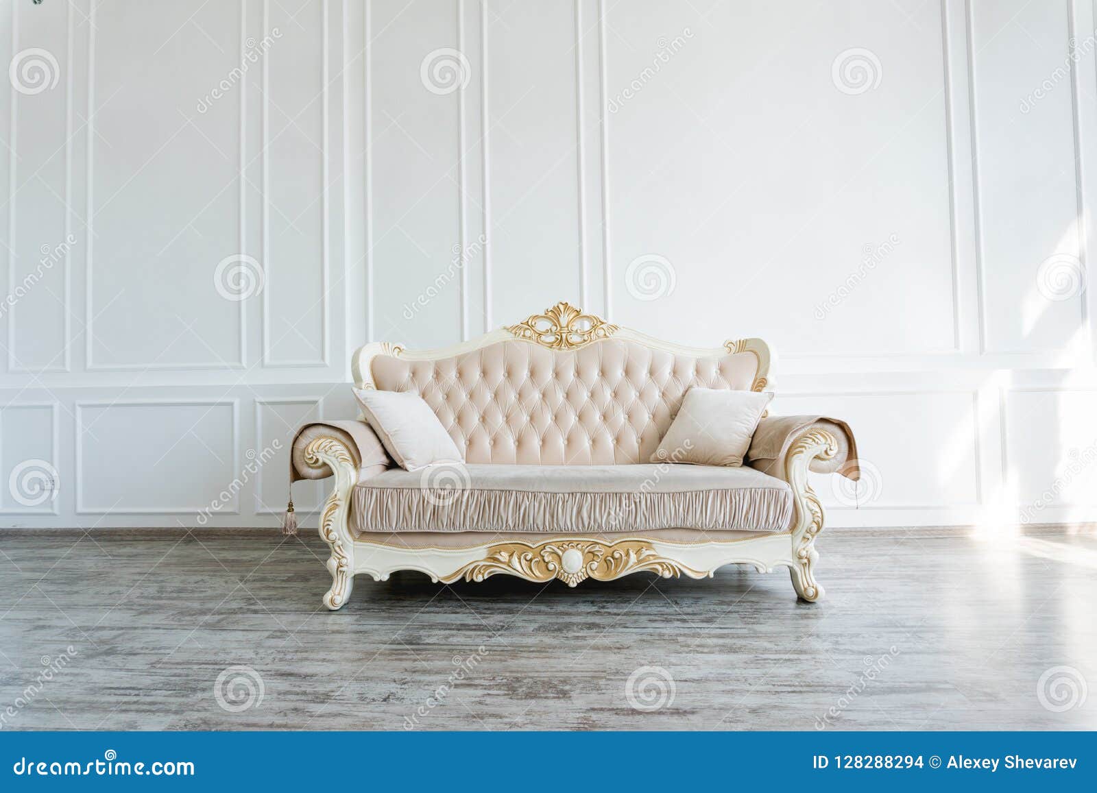 Beautiful Expensive Beige Sofa Against a White Wall in an Empty Room