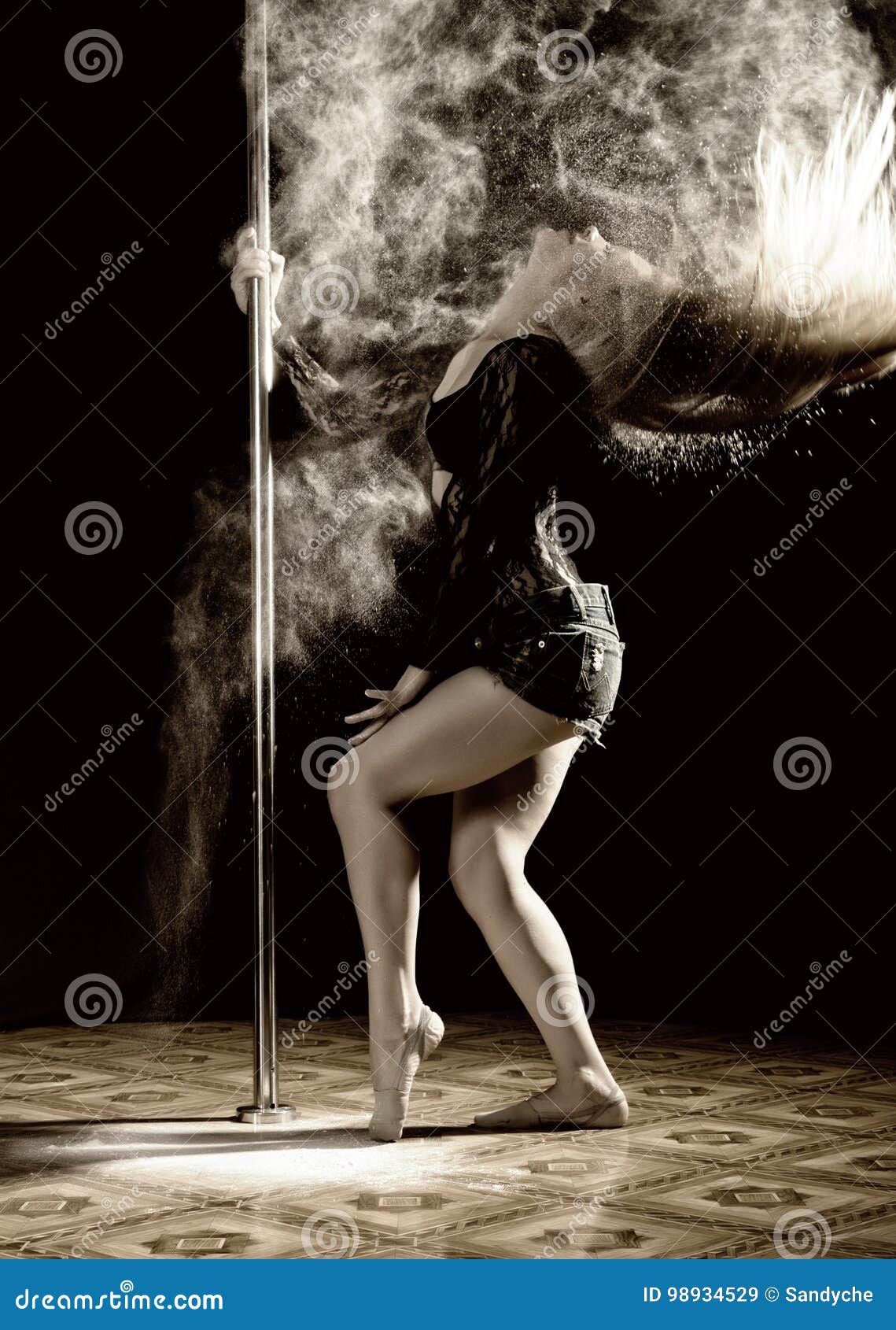 beautiful expressive dencer dancing at studio with flour