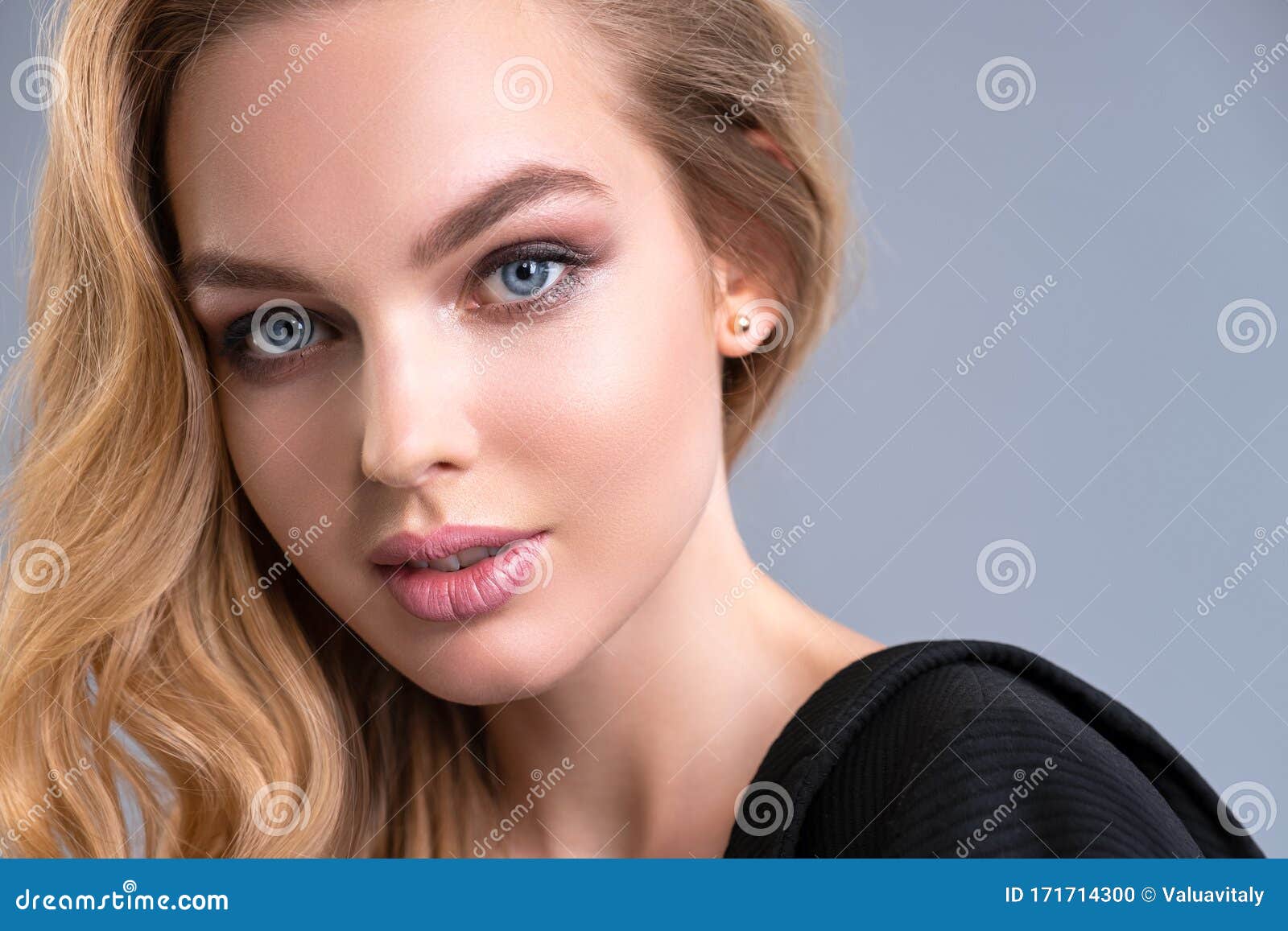 Pretty Blonde Girl With Blue Eyes