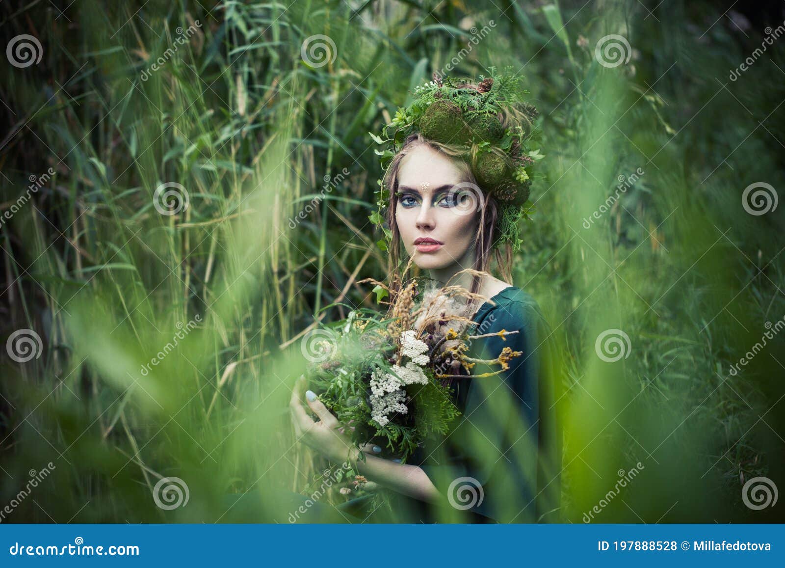 Beautiful Fairy Witch Woman in Green Grass Outdoors. Halloween ...