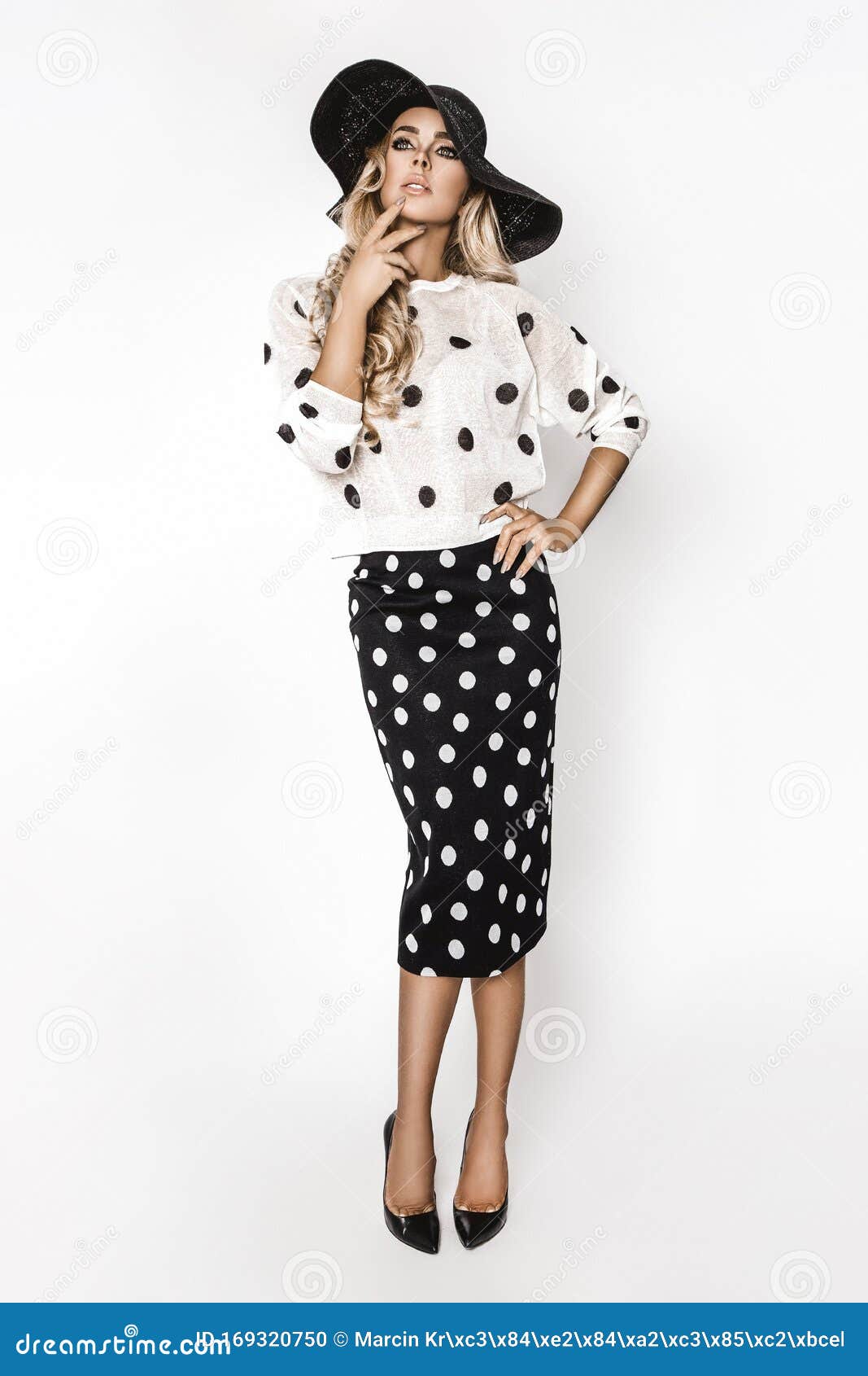 Person in Black and White Polka Dot Dress Holding Golden Fork · Free Stock  Photo