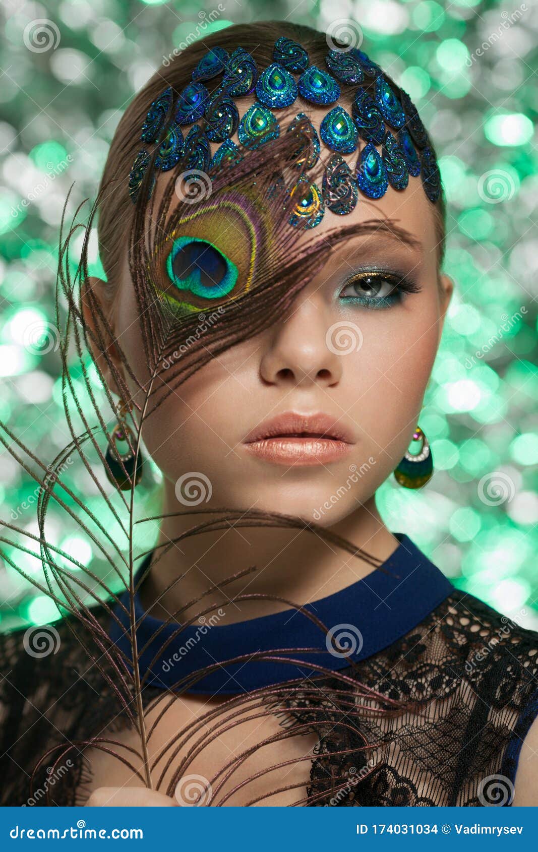 Stunning Woman with Blue and Gold Face Paint and Feathers in Her