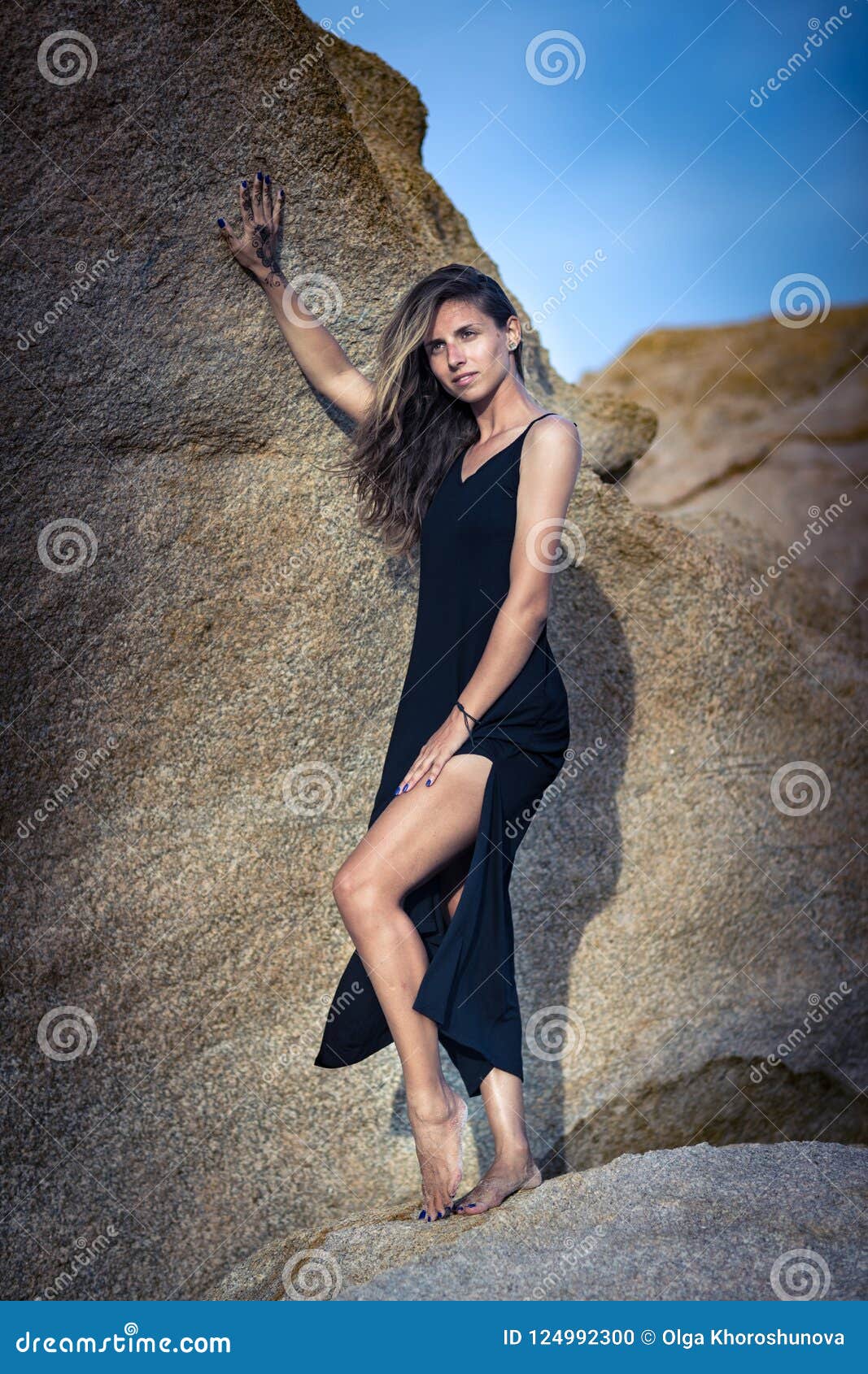 Beautiful Woman  Model  Posing On The Rock  Stock Photo 
