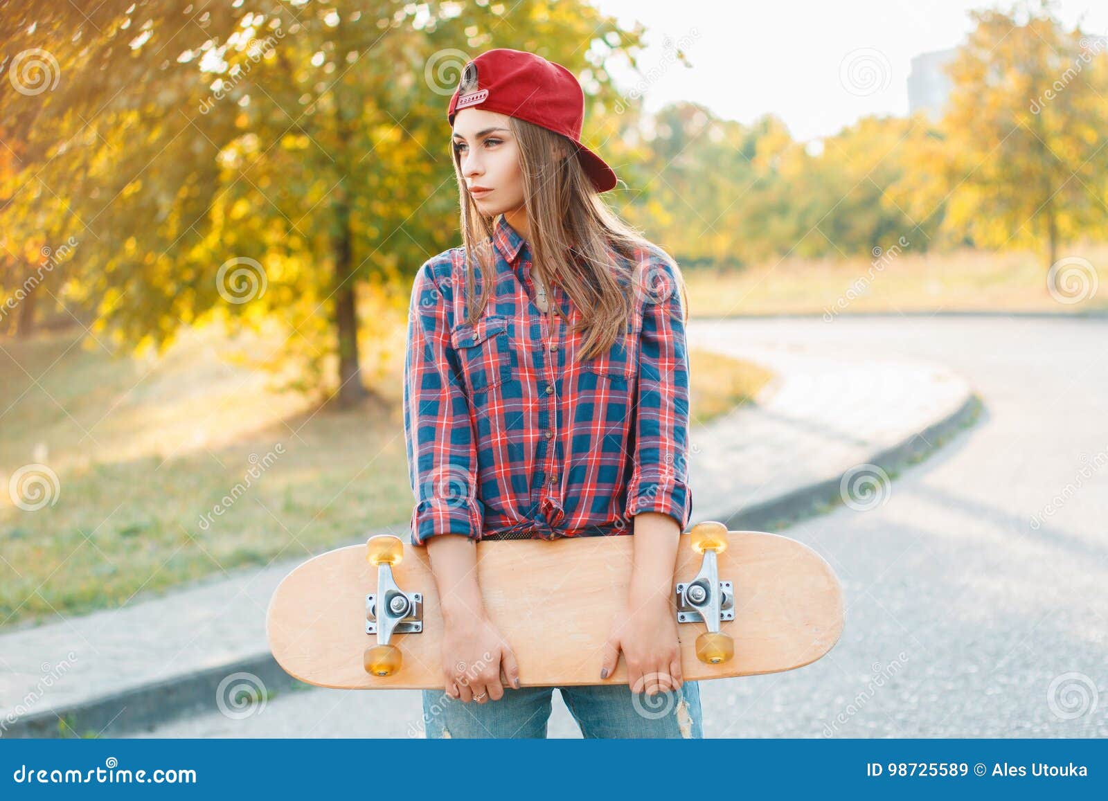 Beautiful and Fashion Young Woman Posing with a Skateboard Stock Image ...