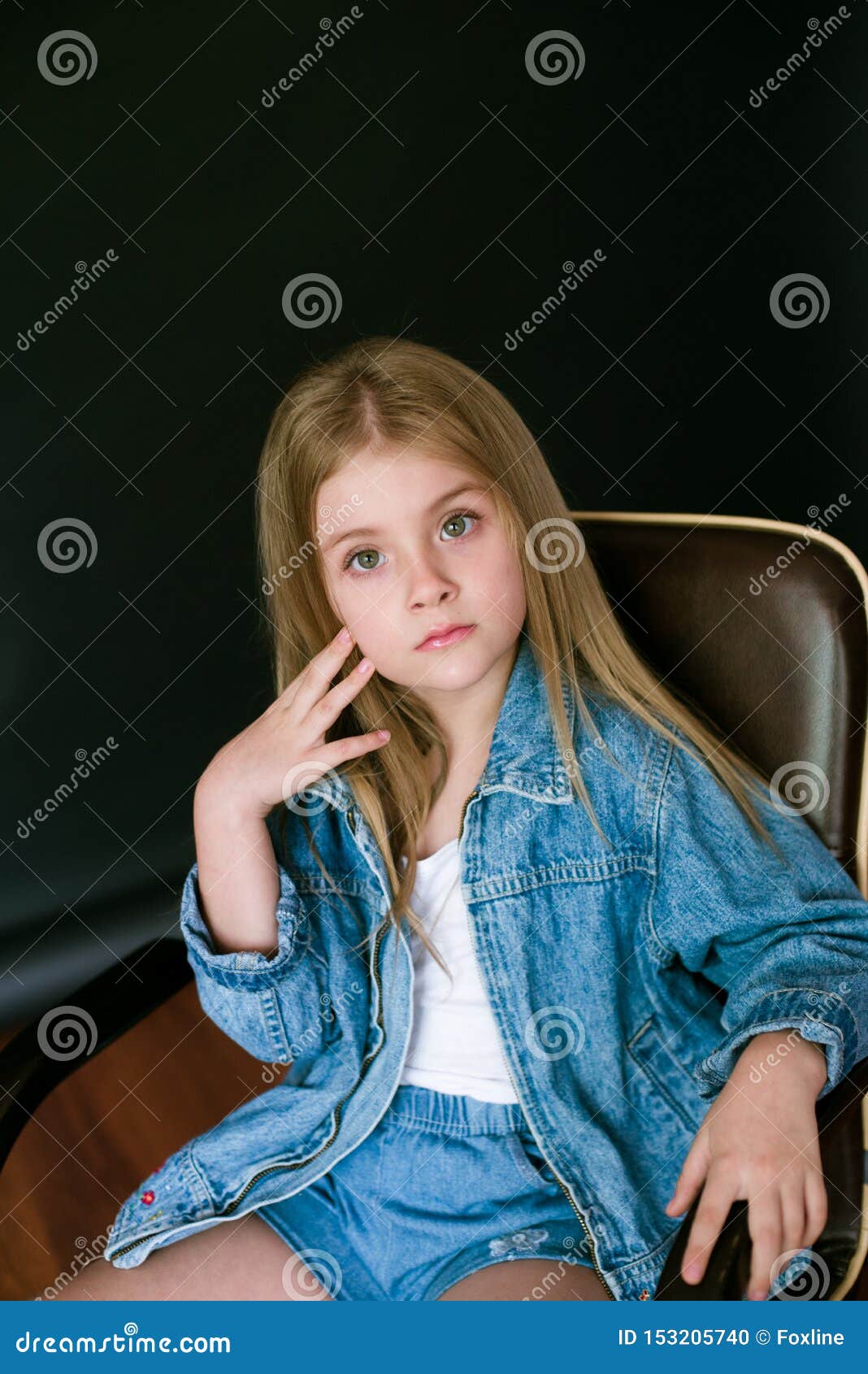 Beautiful Fashionable Little Girl With Blond Hair In Jeans Clothes On A Black Background Stock Photo Image Of Clothing Happy 153205740
