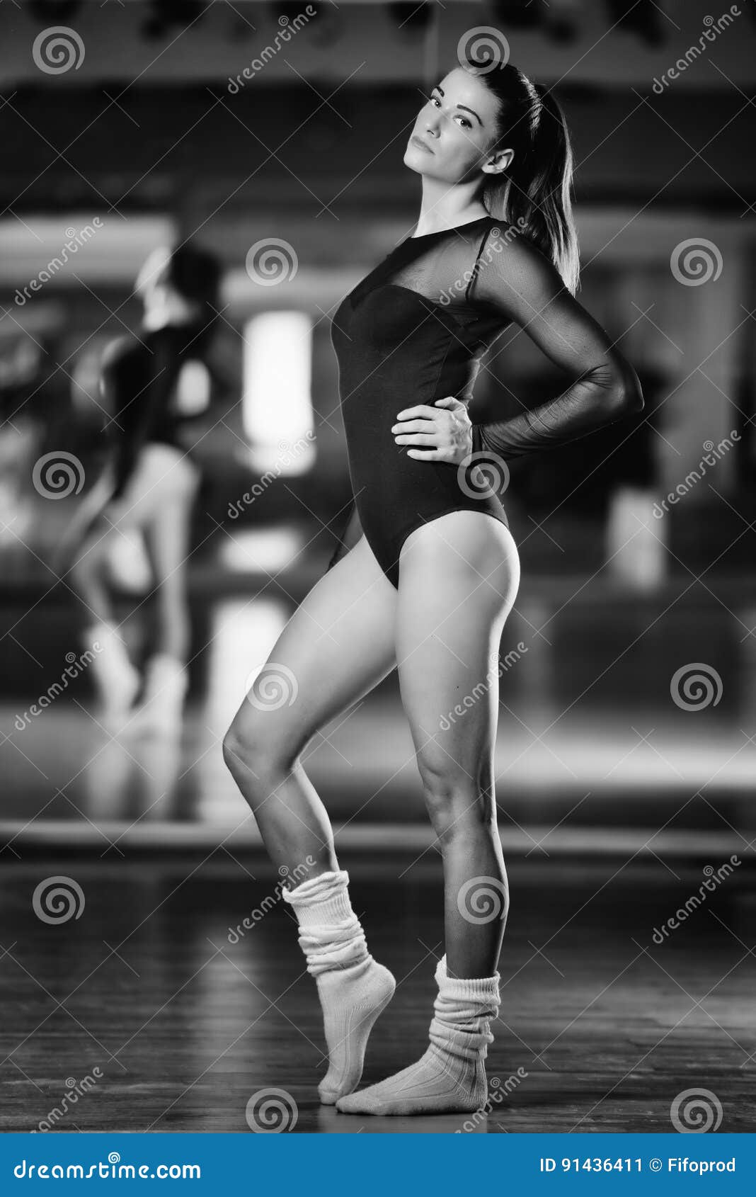 Beautiful Female Dance Artist Posing in Front of a Mirror Stock Image
