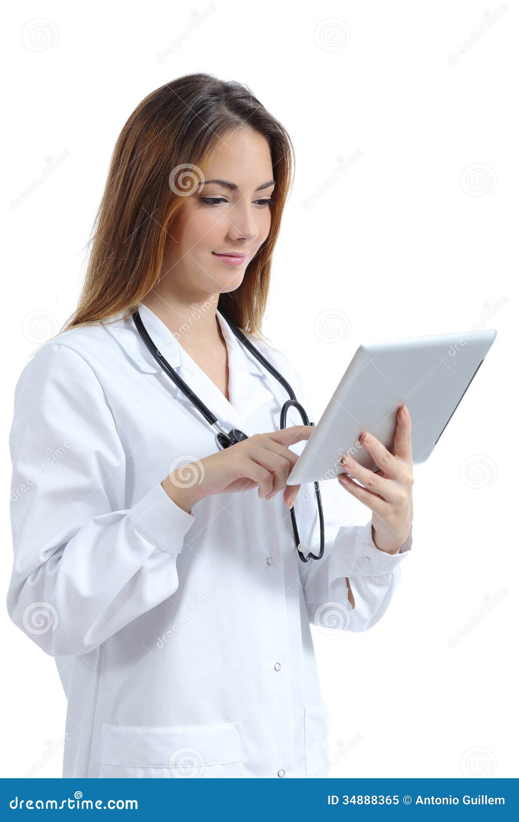 beautiful female doctor browsing a tablet pc while she is working
