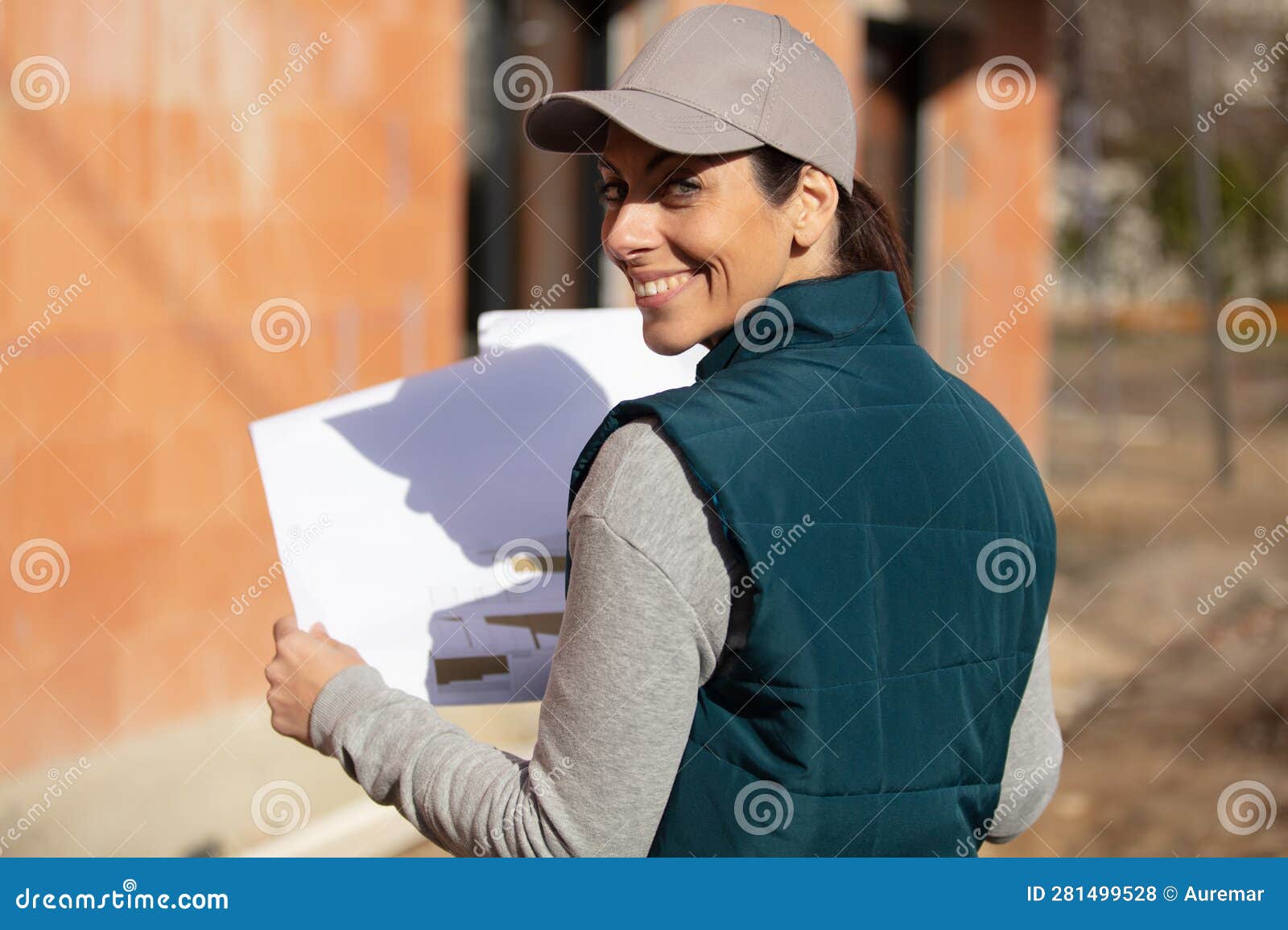 Beautiful Female Engineer Doing Job at Construction Site Outside Stock