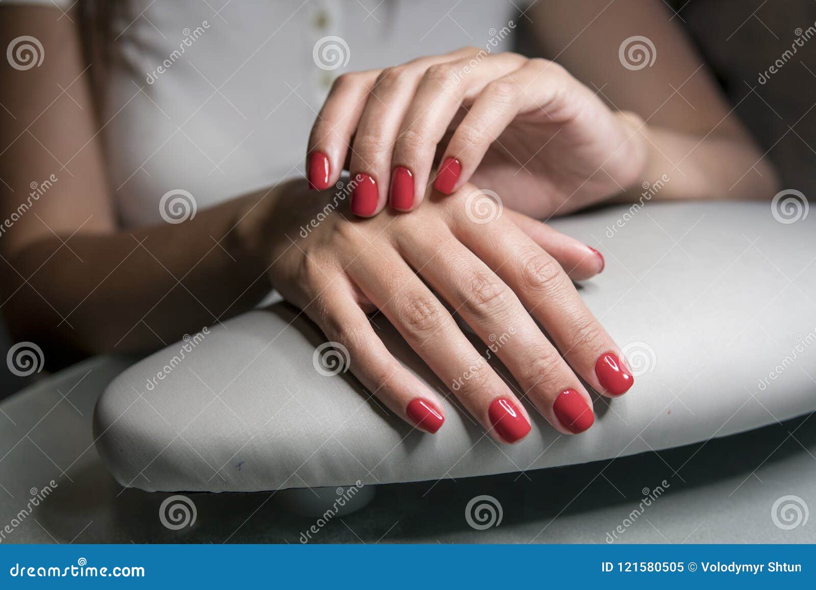 Premium Photo | Manicure. closeup of beautiful woman hands polishing nails  with red nail polish in beauty salon.