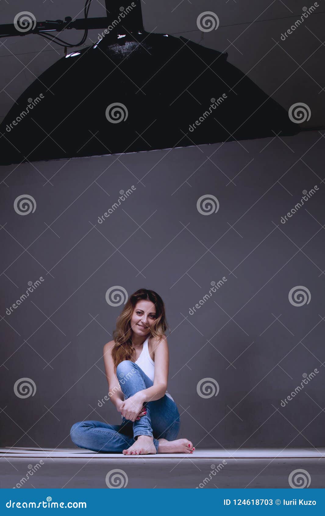 Beautiful Female Model Posing at Studio in the Light Softbox Stock