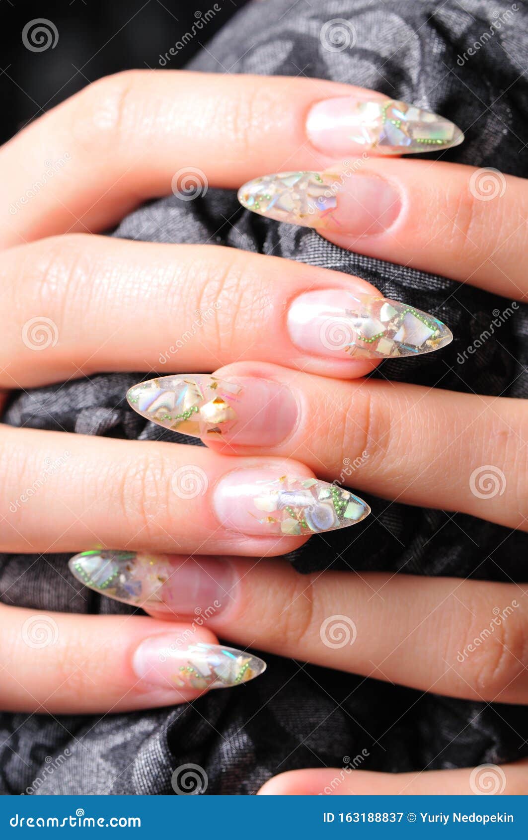 Aquarium Nautical Nail Art Design On Long Nails Transparent With Small  Shells Inside And Sequins On The Outside Creative Manicure On Long Nails  Stock Photo Picture and Royalty Free Image Image 138386473