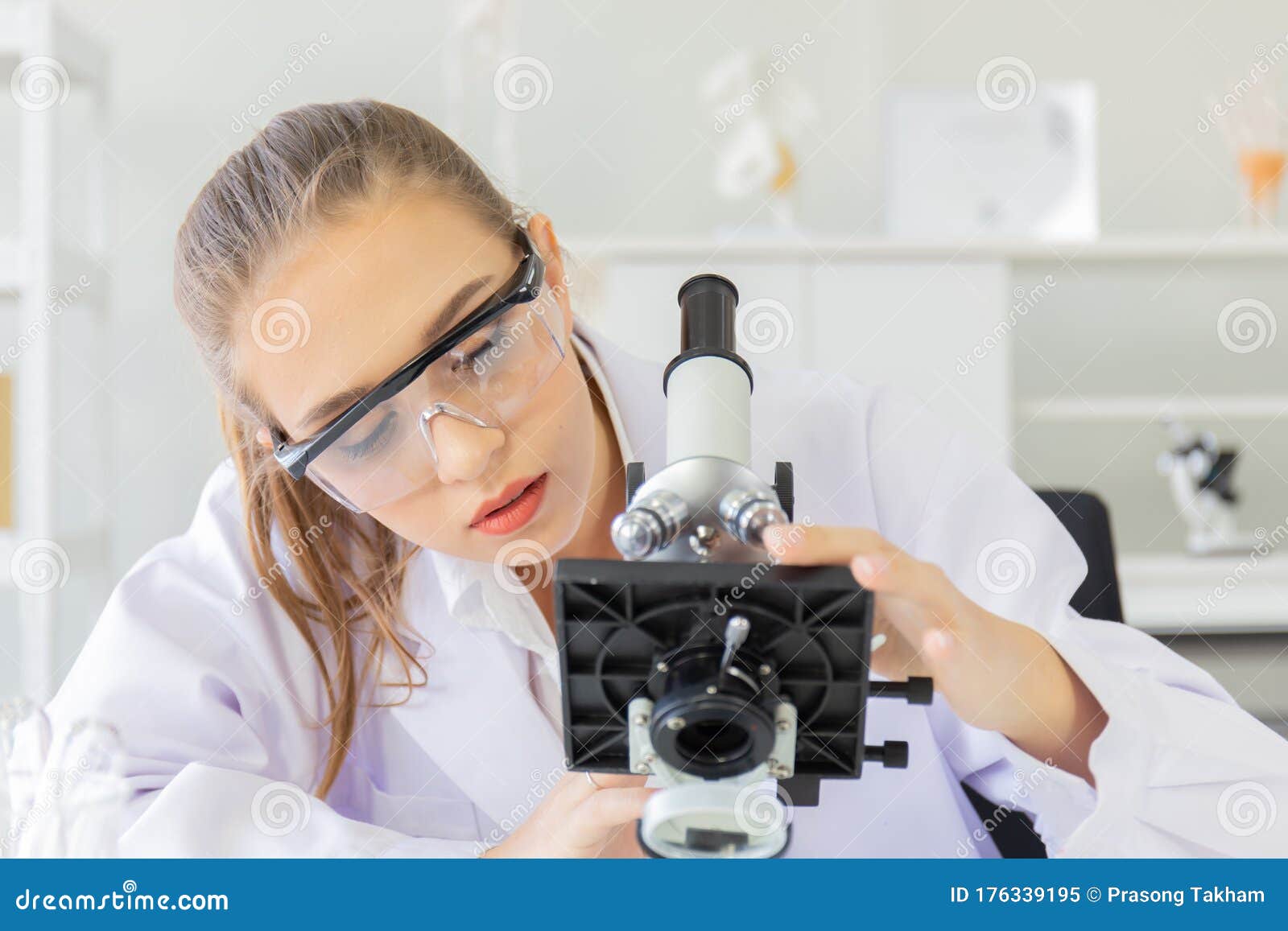 Beautiful Female Scientist Is Operating In A Science Lab With Various ...