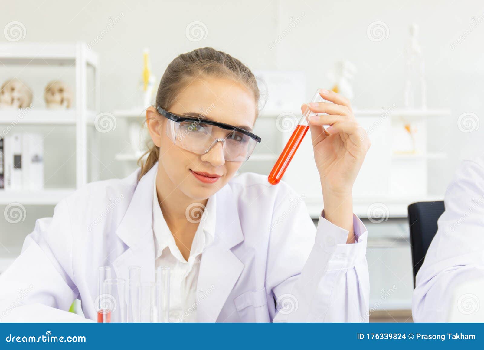 A Beautiful Female Scientist is Operating in a Science Lab with Various ...