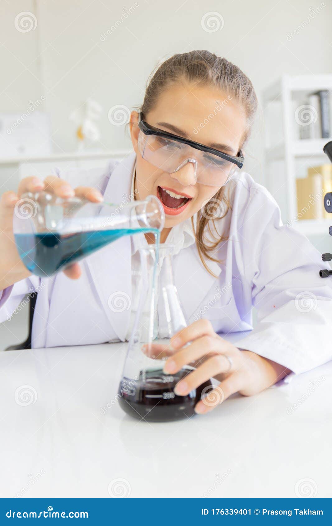 Beautiful Female Scientist is Operating in a Science Lab with Various ...