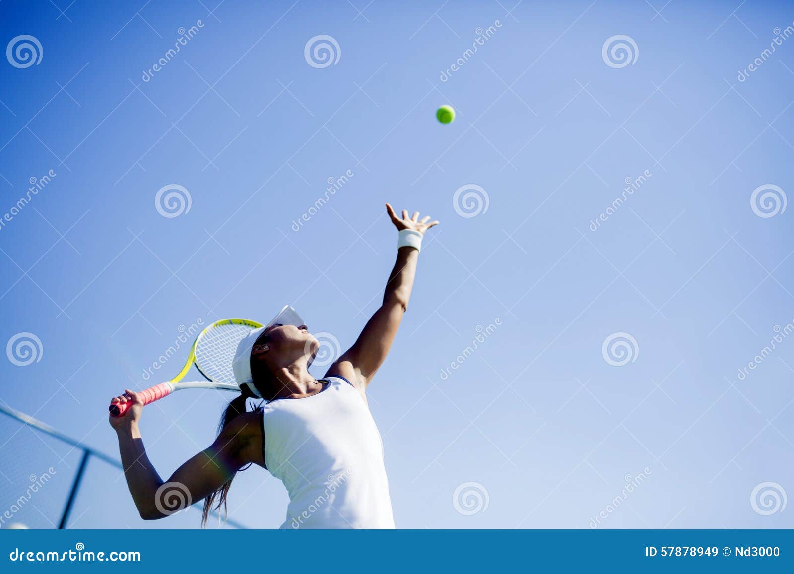 beautiful female tennis player serving