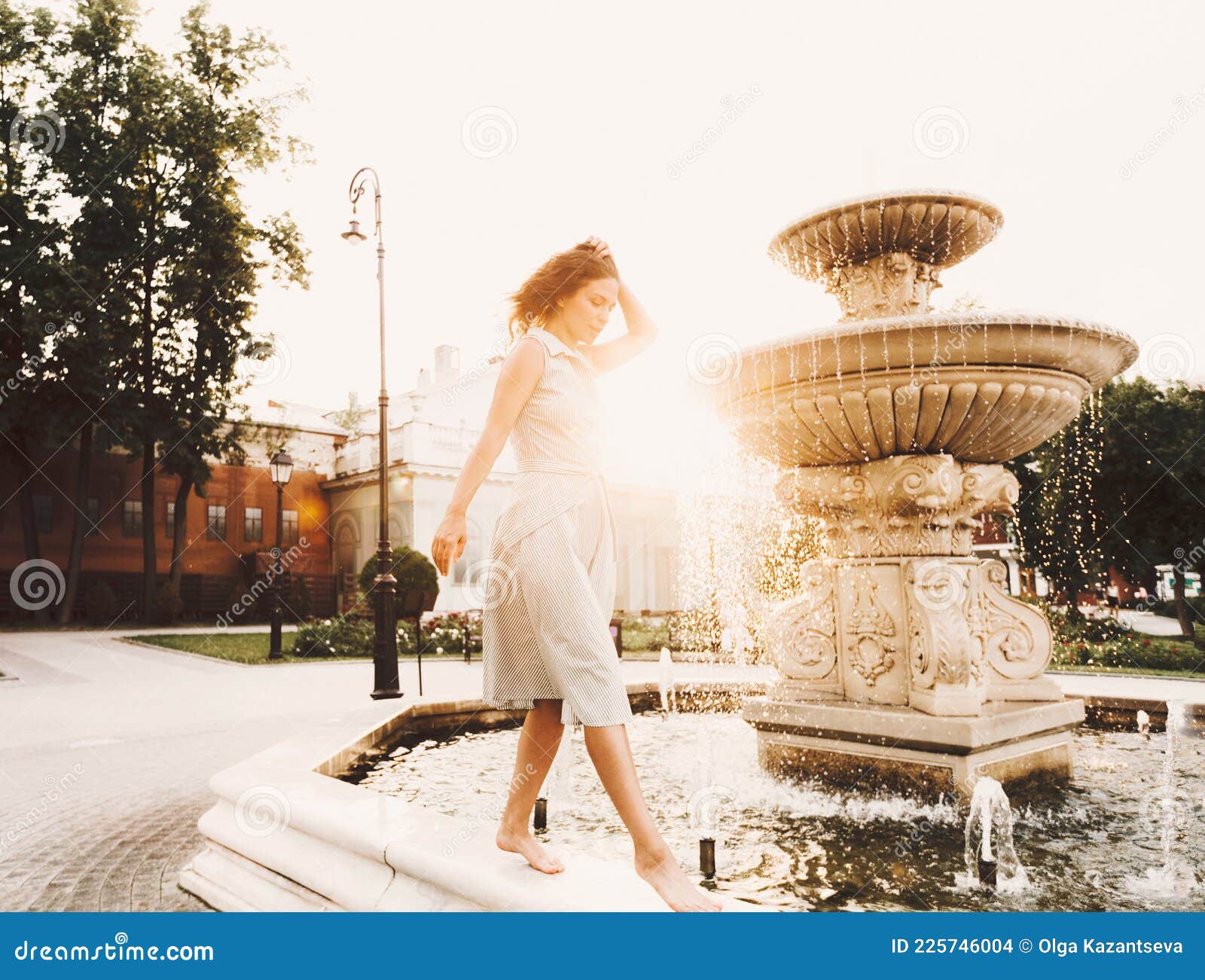 https://thumbs.dreamstime.com/z/beautiful-feminine-young-woman-dress-barefoot-against-backdrop-city-view-fountain-rays-sunlight-summer-225746004.jpg