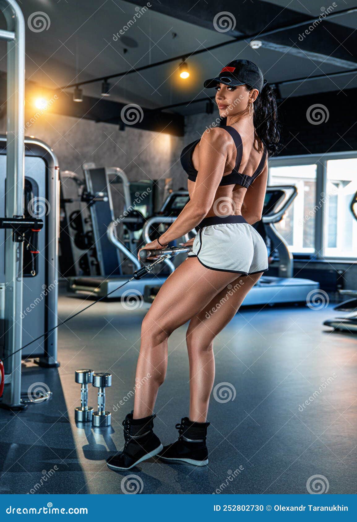 Beautiful Fitness Brunette Girl with Perfect Back Muscles and Shapes Posing  in the Gym Stock Photo - Image of physical, shape: 252802730