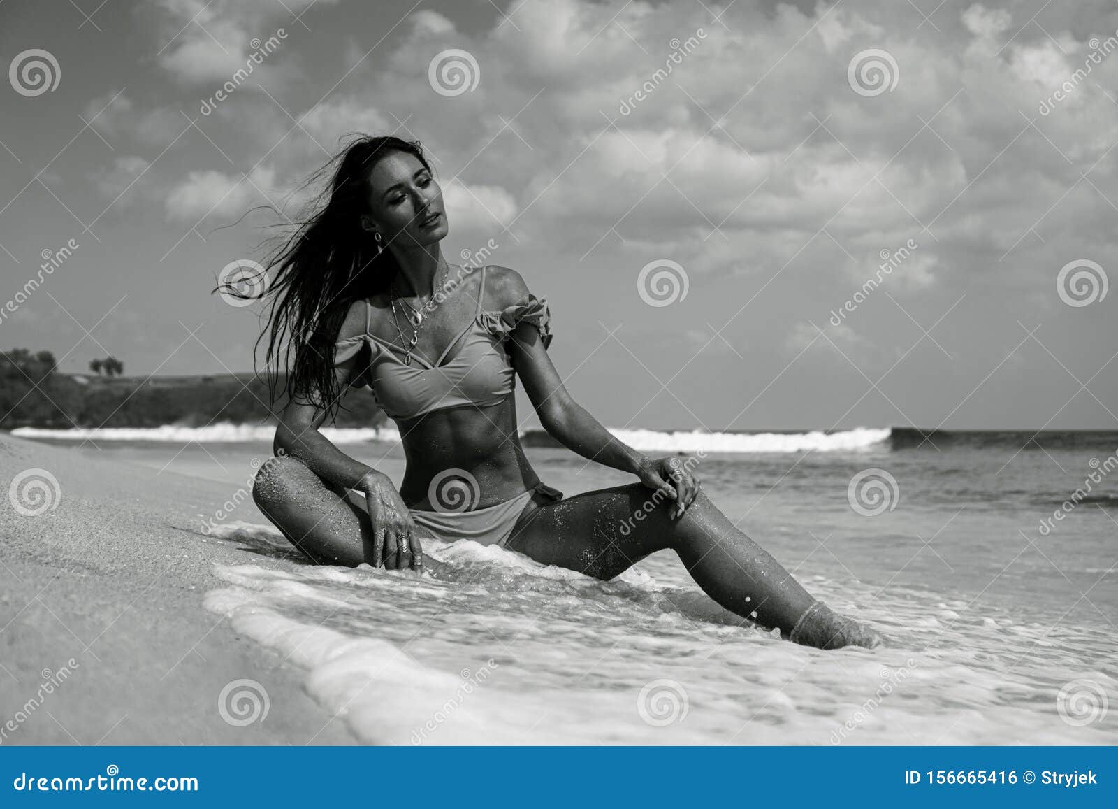 Beautiful Fitness Woman in Bikini Posing at the Beach Stock Photo picture image picture