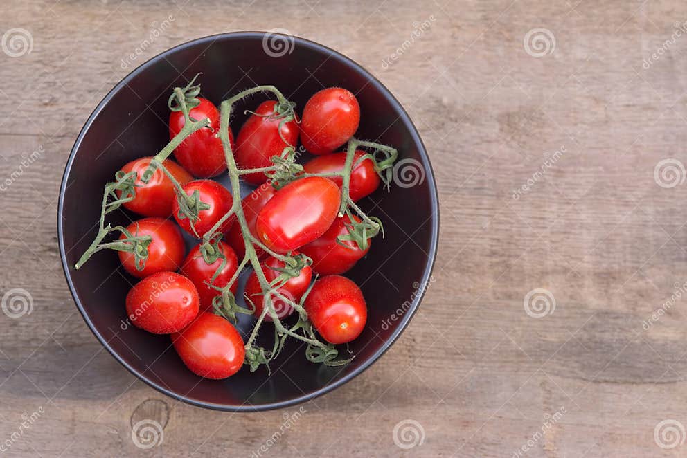 Beautiful Fresh Perino Snacking Tomatoes in Bowl in Rustic Setting