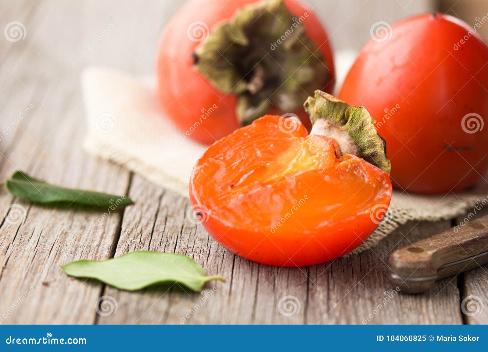 Beautiful Fresh Persimmon Fruit. Ripe Persimmon on a Wooden Background ...