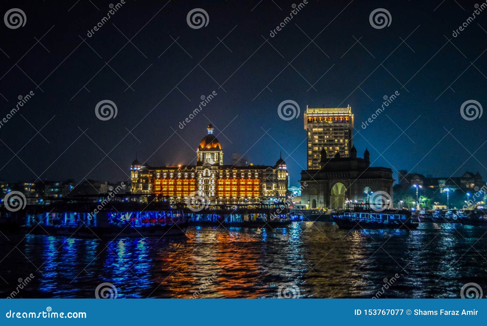 beautiful gateway of india near taj palace hotel on the mumbai harbour with many jetties on arabian sea