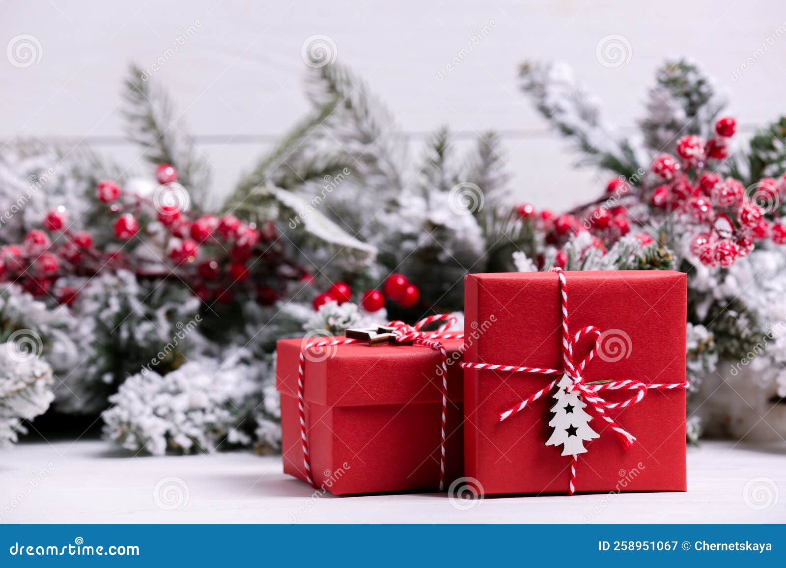 Beautiful Gift Boxes and Christmas Decor on White Table. Space for Text