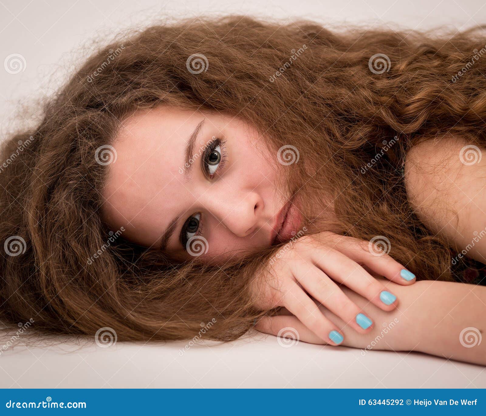 Beautiful Ginger Teenage Girl On The Floor Stock Photo