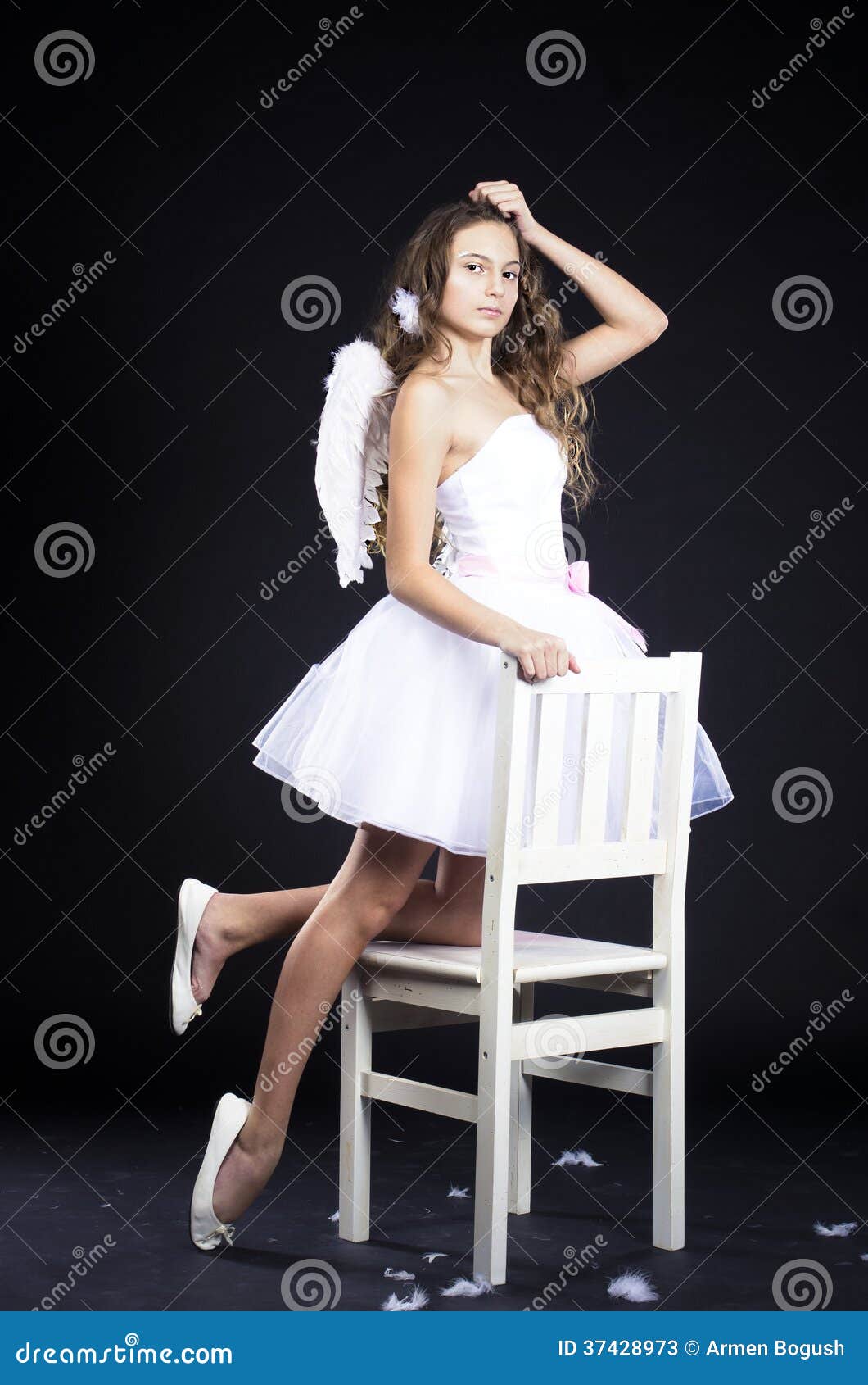 Portrait Of Beautiful Woman With White Angel Wings On 