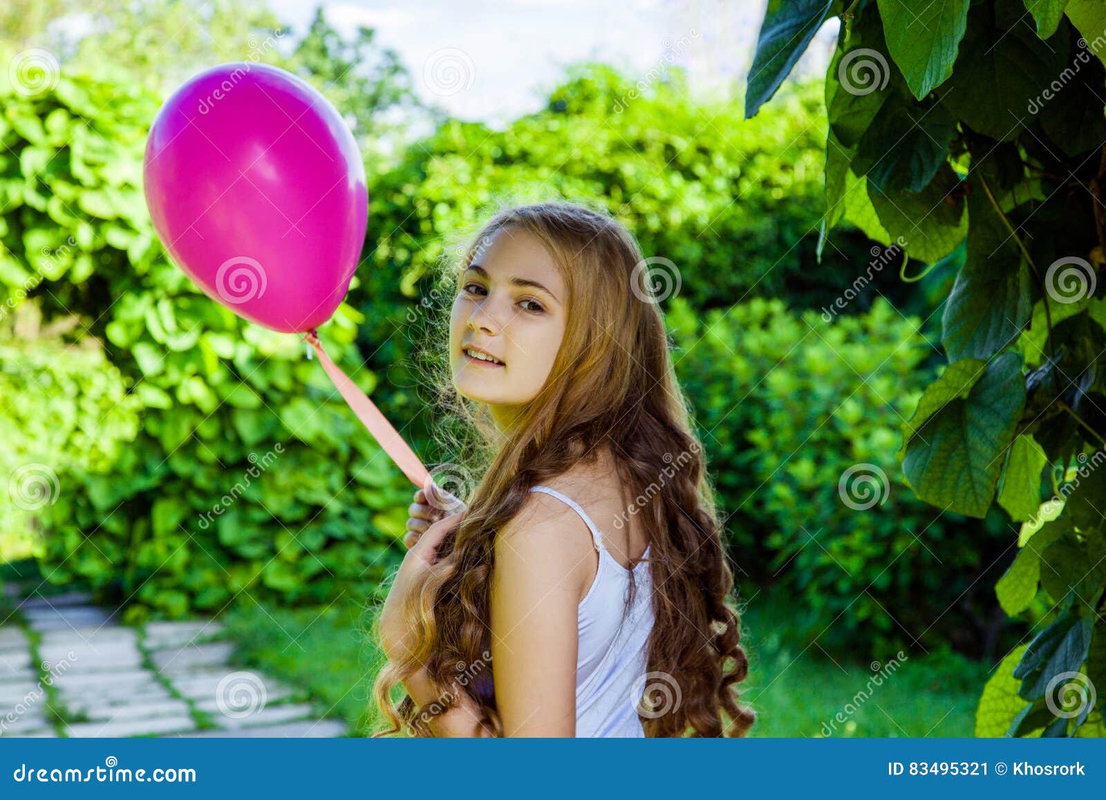 beautiful girl with balloon have a fun in the park.