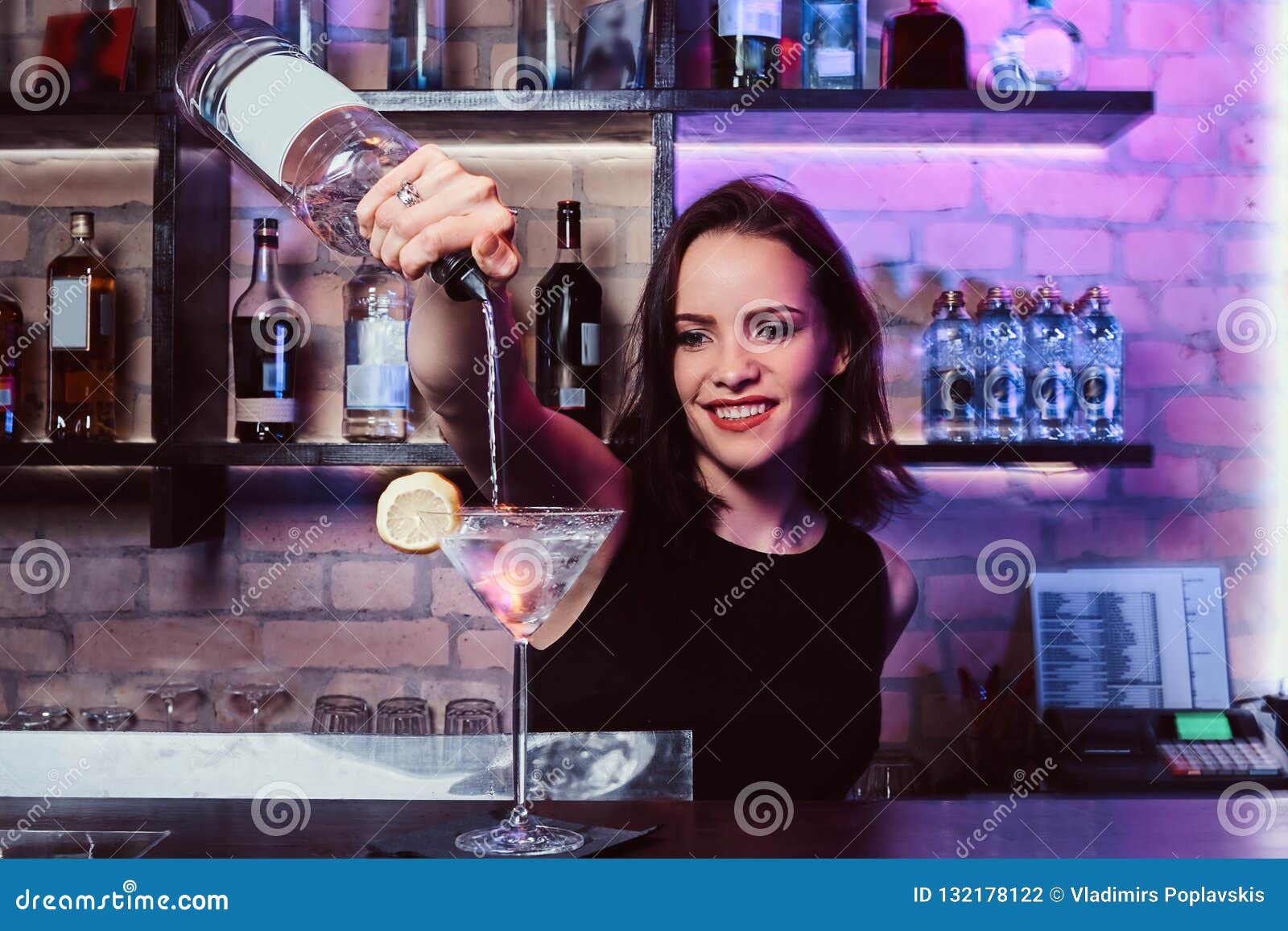 A Beautiful Girl Bartender Prepares an Alcoholic Cocktail with Vodka ...