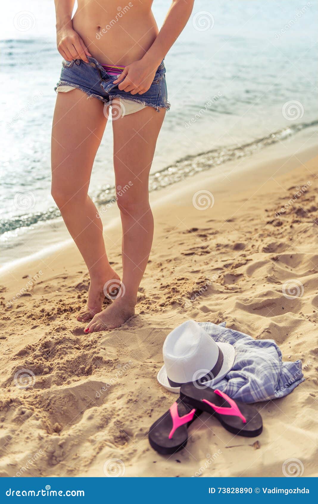 Taking Off Swimsuit Beach Stock Photos - Free & Royalty-Free Stock Photos  from Dreamstime