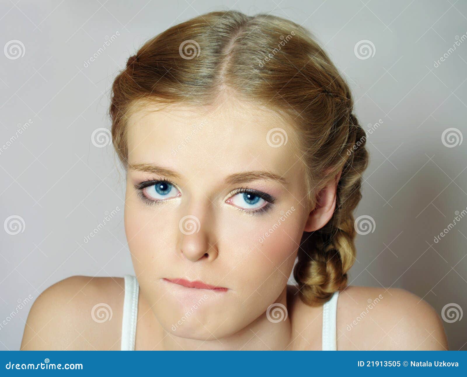 Close-up Face Of Pretty Girl With Beautiful Big Blue Eyes 