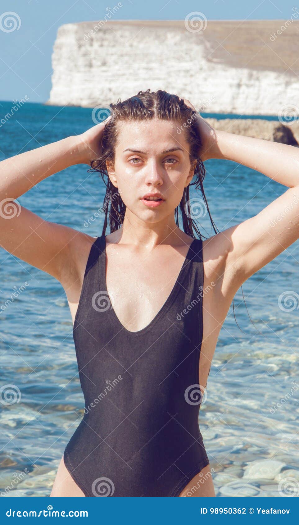 Beautiful Girl In A Bikini On A Background Of The Sea Stock Photo