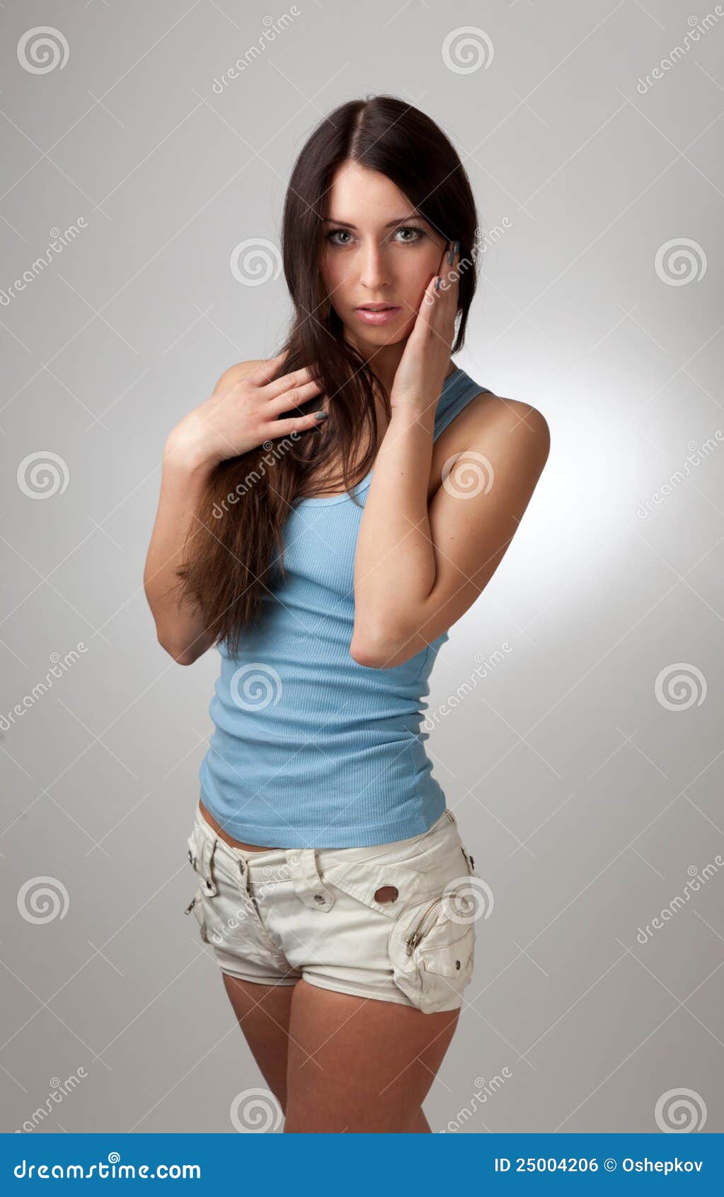 A Beautiful Girl in a Blue T-shirt with a Gray Bac Stock Photo - Image ...