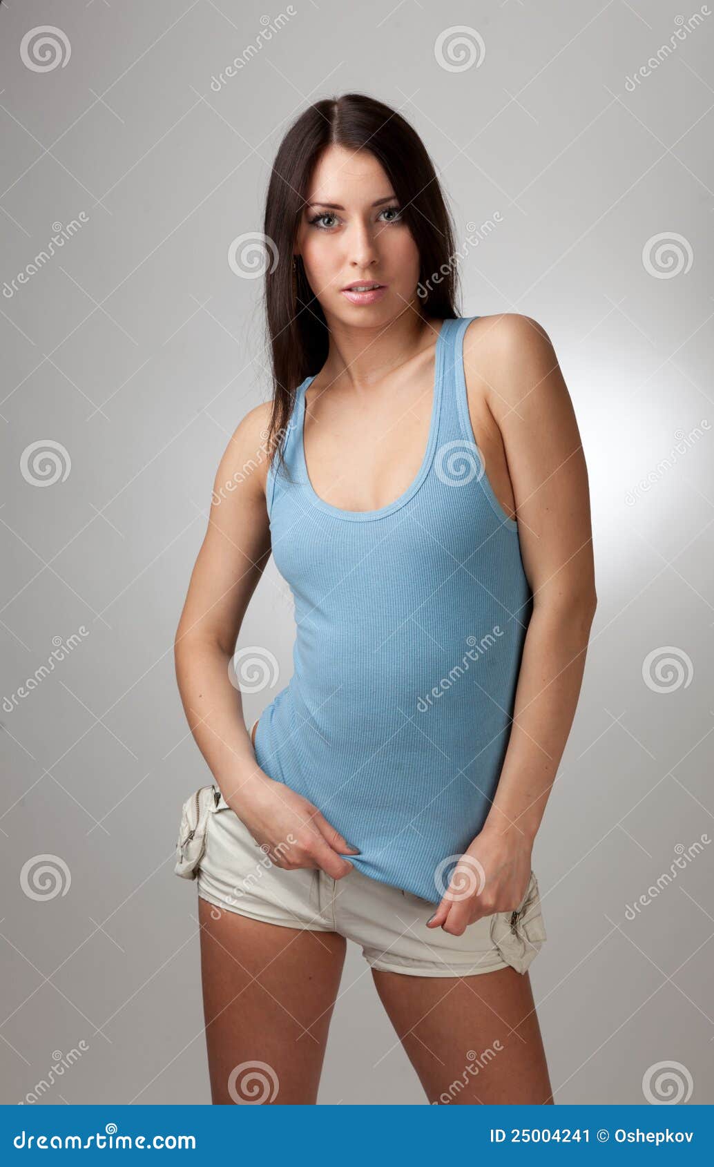 A Beautiful Girl in a Blue T-shirt with a Gray Bac Stock Image - Image ...