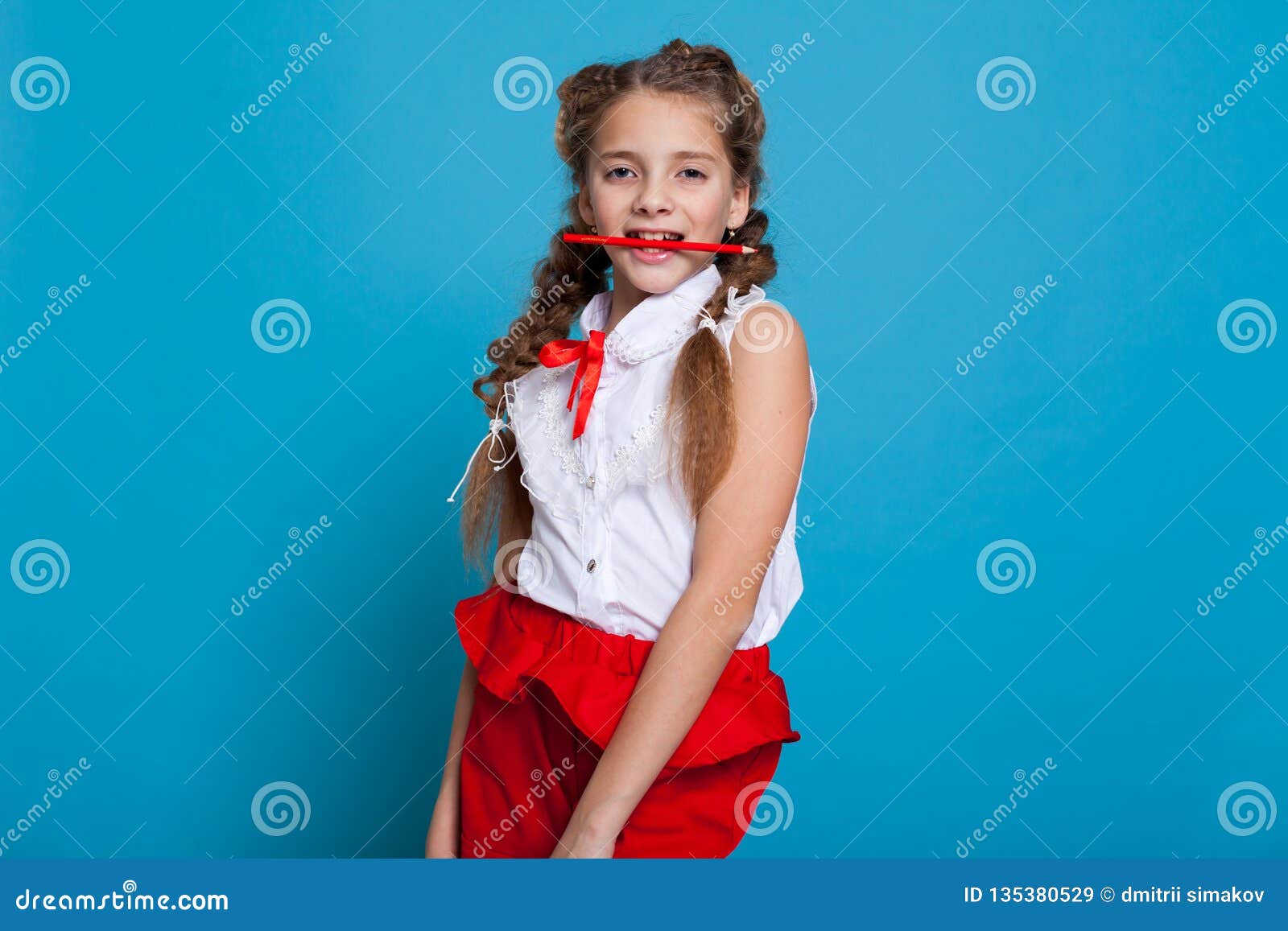 Beautiful Girl With Braids With A Red Pencil On Blue