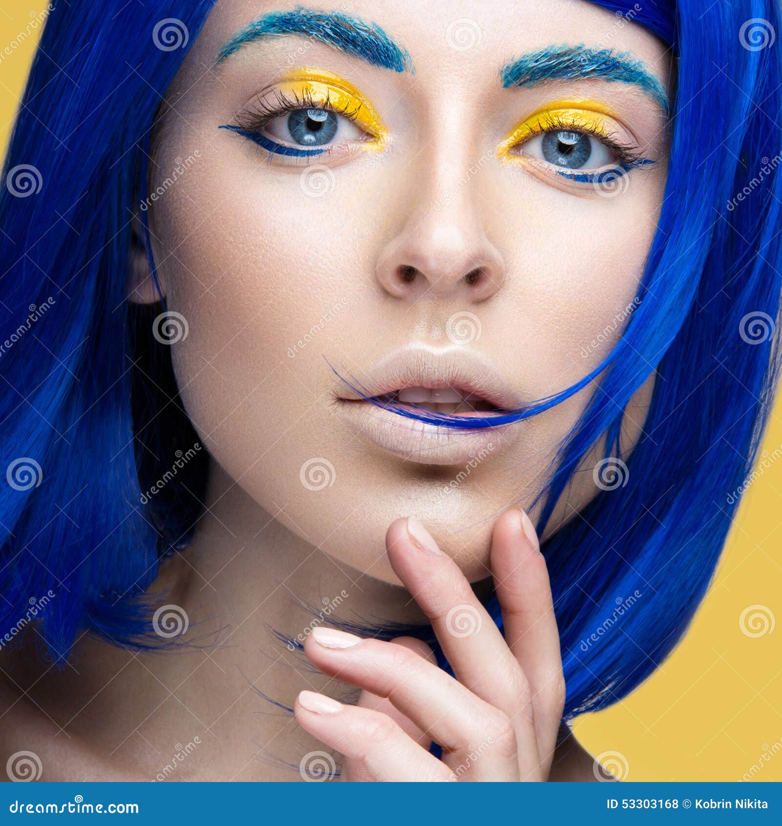 beautiful girl in a bright blue wig in the style of cosplay and creative makeup. beauty face. art image.