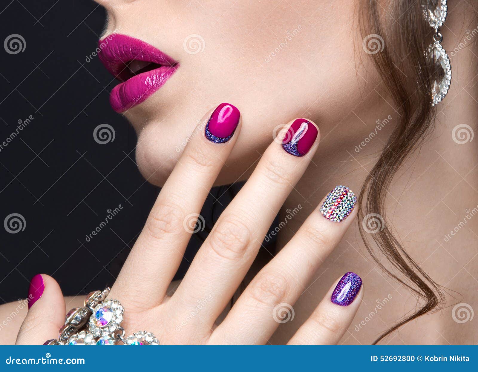 beautiful girl with a bright evening make-up and pink manicure with rhinestones. nail . beauty face.