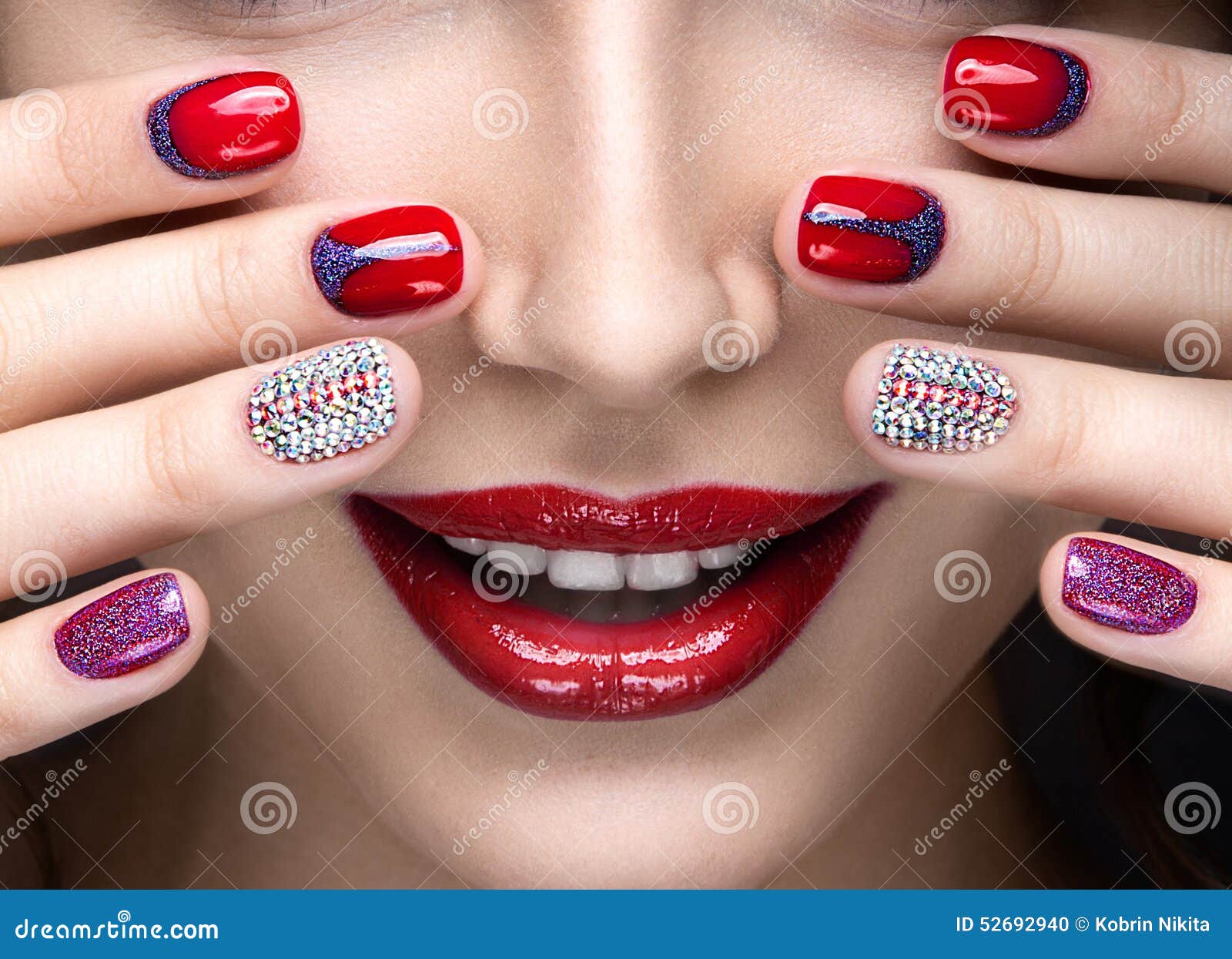 beautiful girl with a bright evening make-up and red manicure with rhinestones. nail . beauty face.