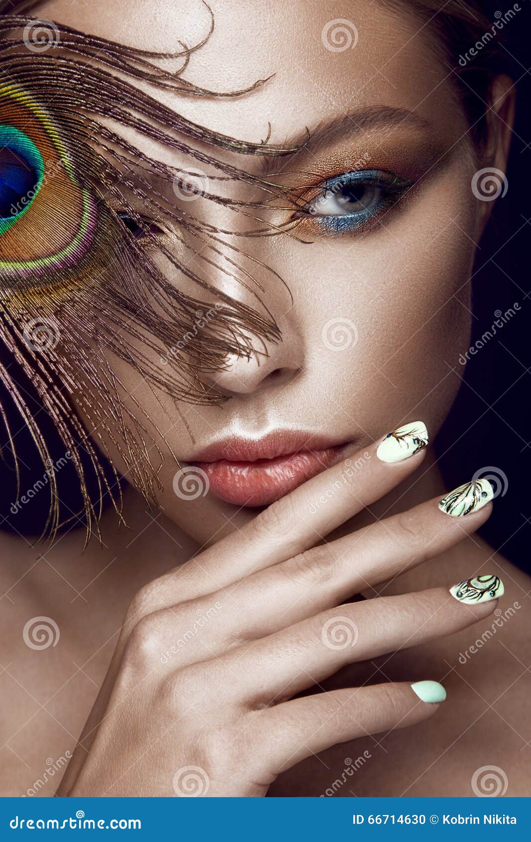 Beautiful Girl with Bright Makeup, Manicure Design and Peacock Feather ...