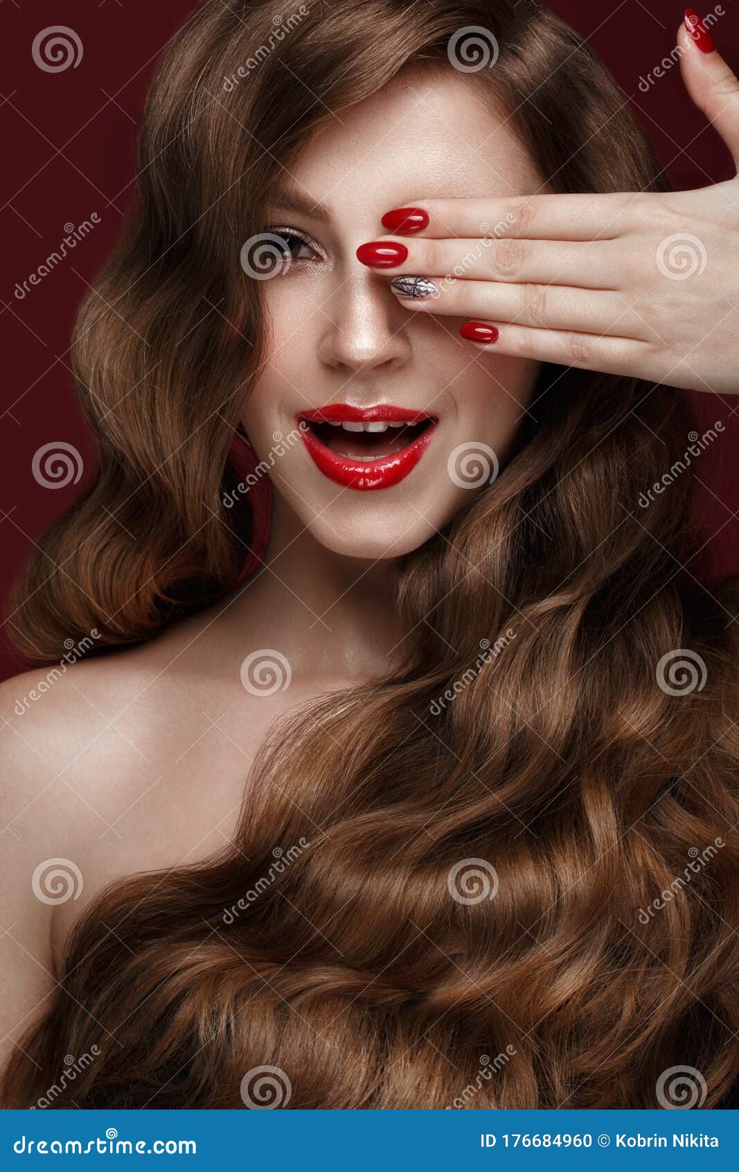 Beautiful Girl With A Classic Make Up Curls Hair And Red Nails 