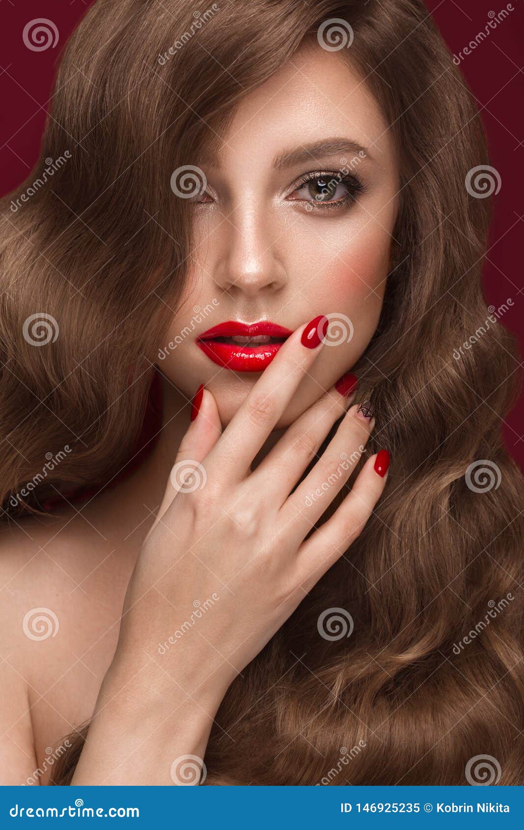 Beautiful Girl With A Classic Makeup Curls Hair And Red Nails 