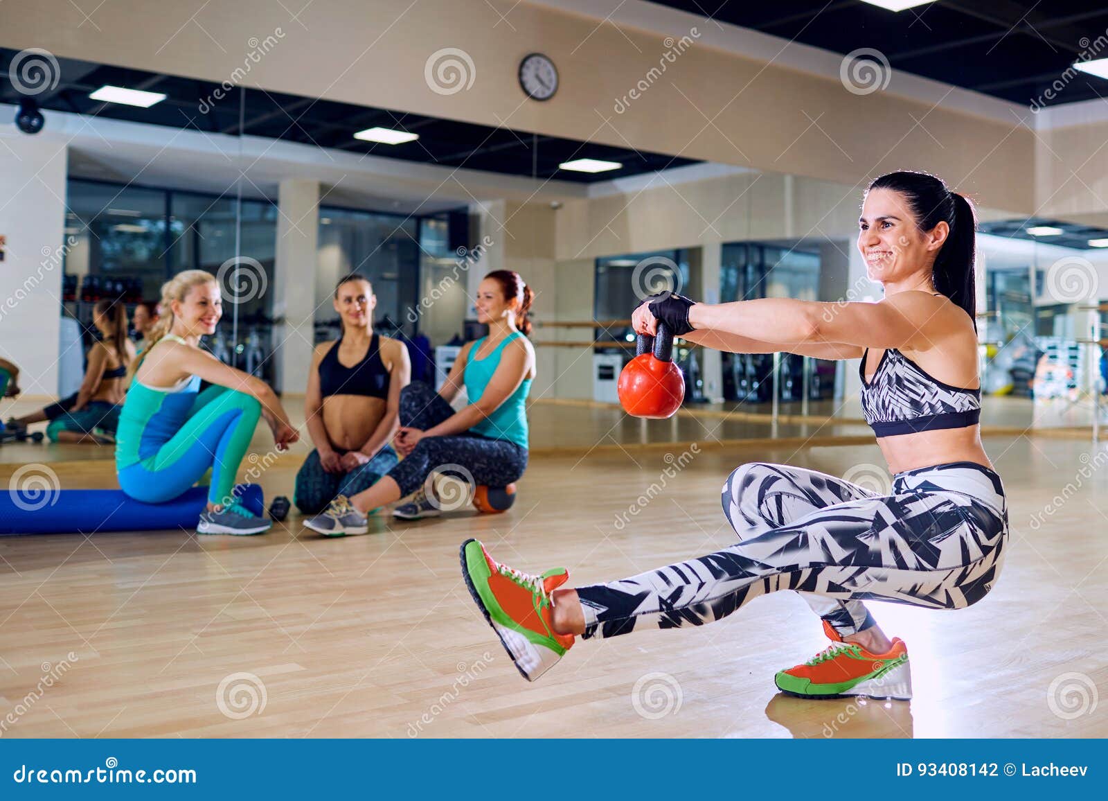 Beautiful Girl Doing Situps on One Leg in the Gym Stock Photo Image