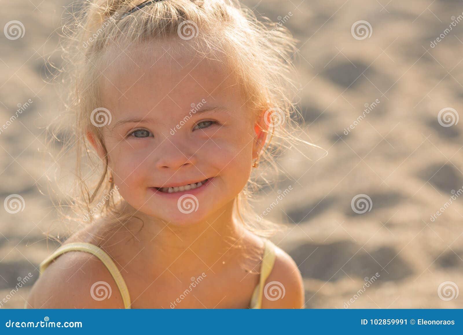 beautiful girl with down syndrome on the beach