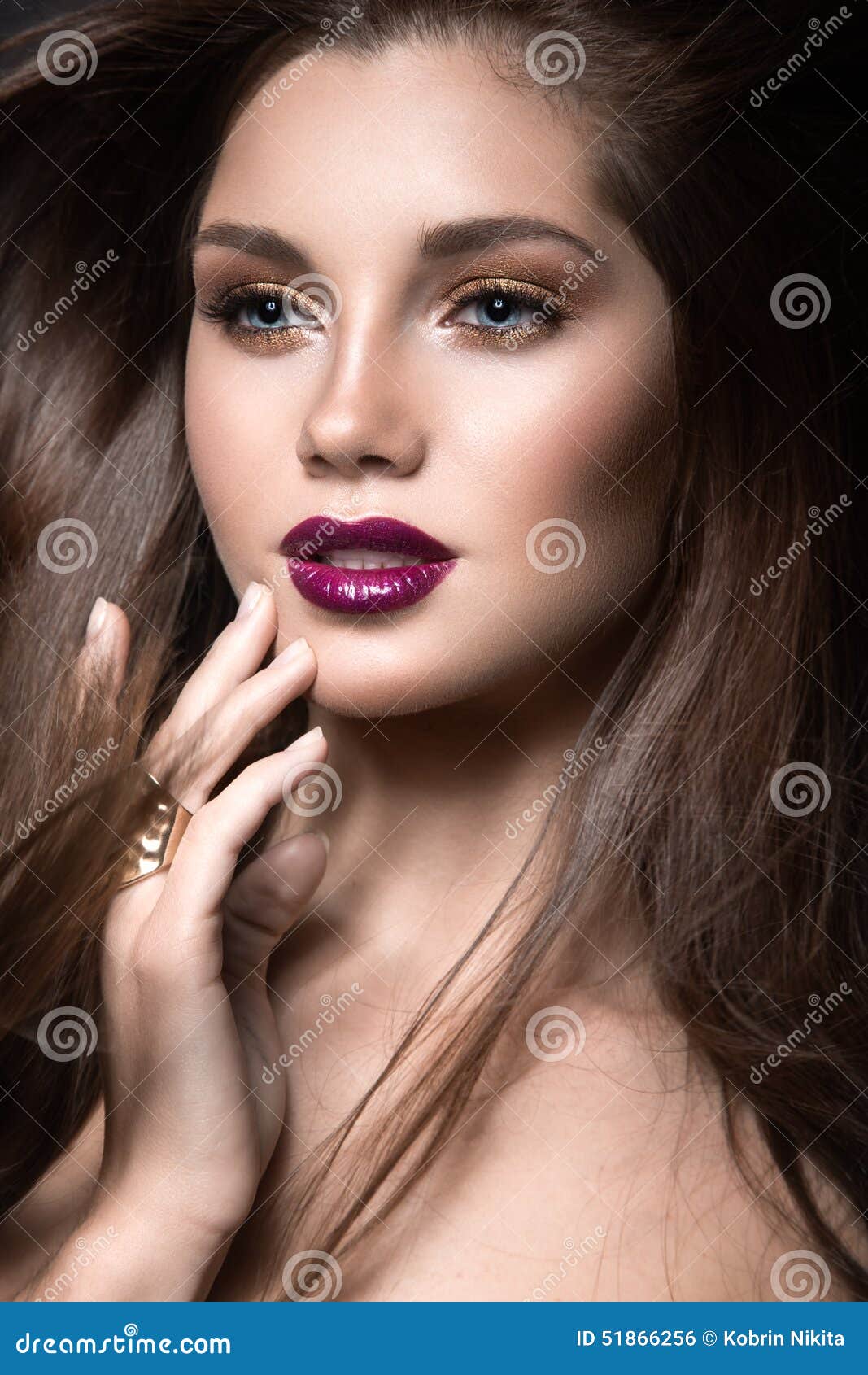 Beautiful Girl with Golden Makeup and Burgundy Lips with the Wind in ...