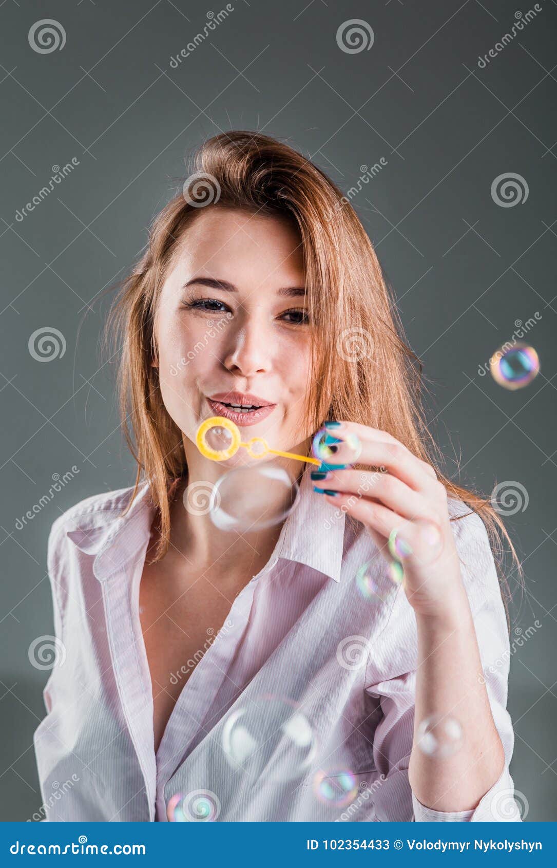 Girl Playing With Soap Bubbles S