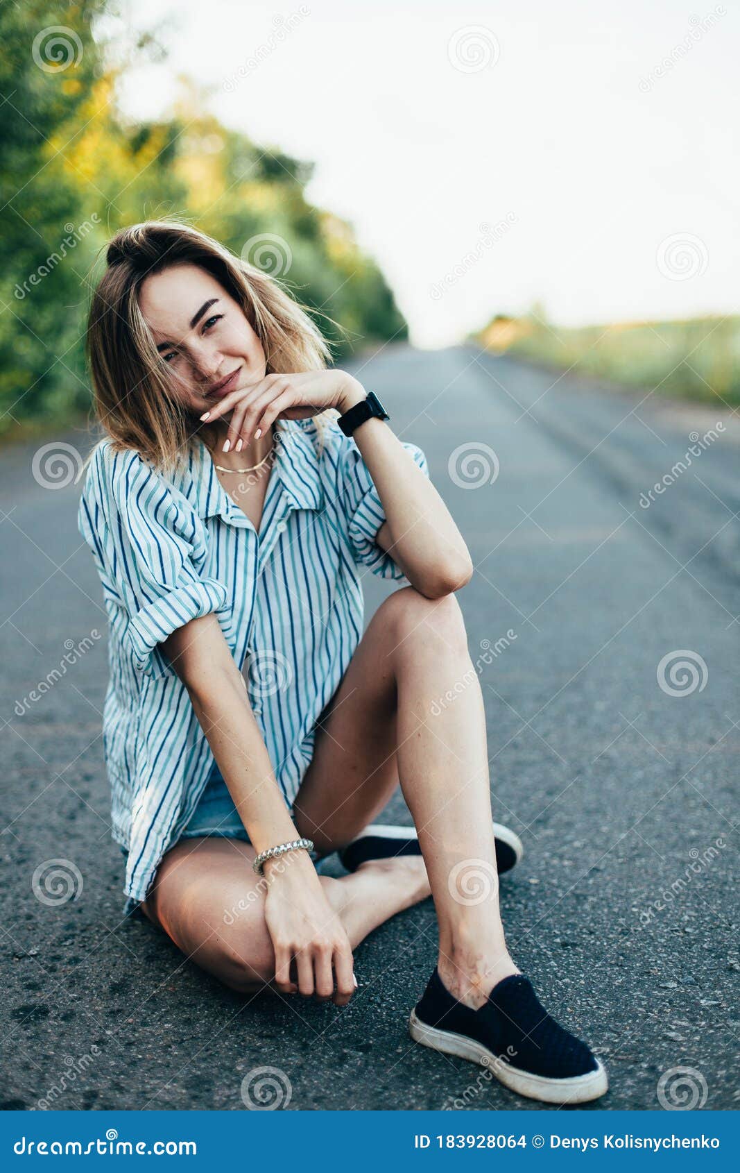 Beautiful Girl Hitchhiking on the Track in a Man`s Shirt Stock Photo ...